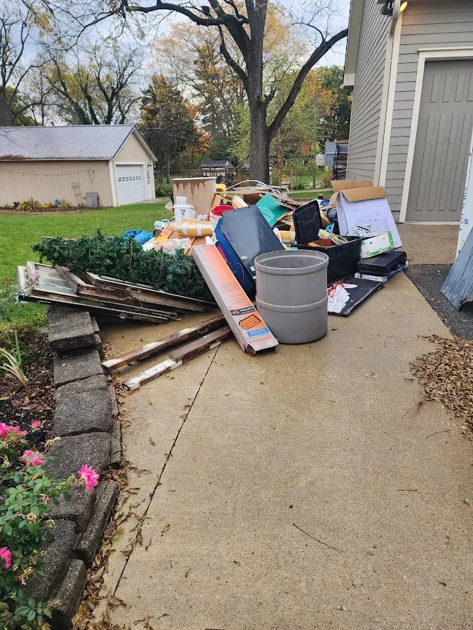 Dumpster being loaded with debris for Commercial Dumpster Rental in Northumberland